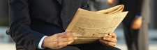 Hands with newspaper